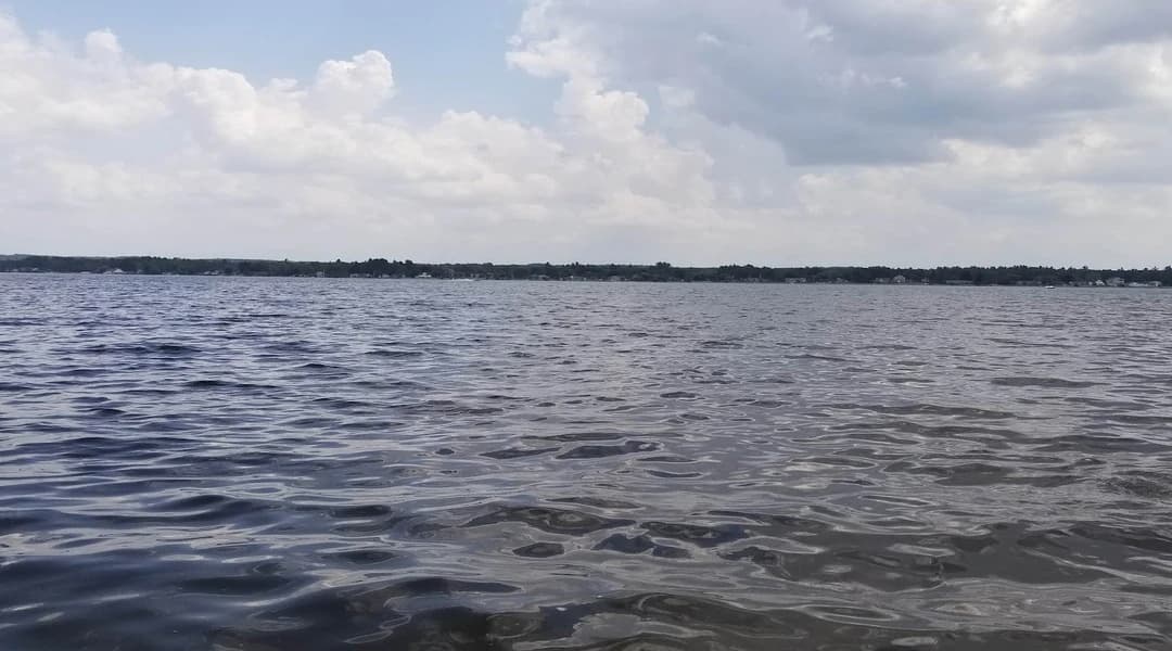Lake Cadillac shoreline and open water — boating and electronics rigging backdrop